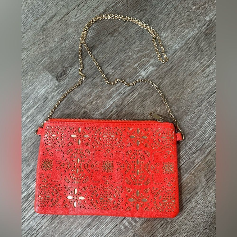 Anthropologie Street Level faux red leather purse with chain shoulder strap.